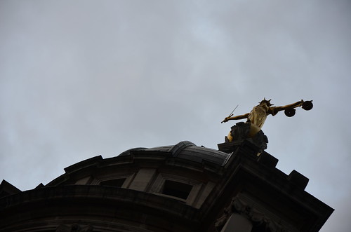 Justice holds her scales atop the Old Bailey
