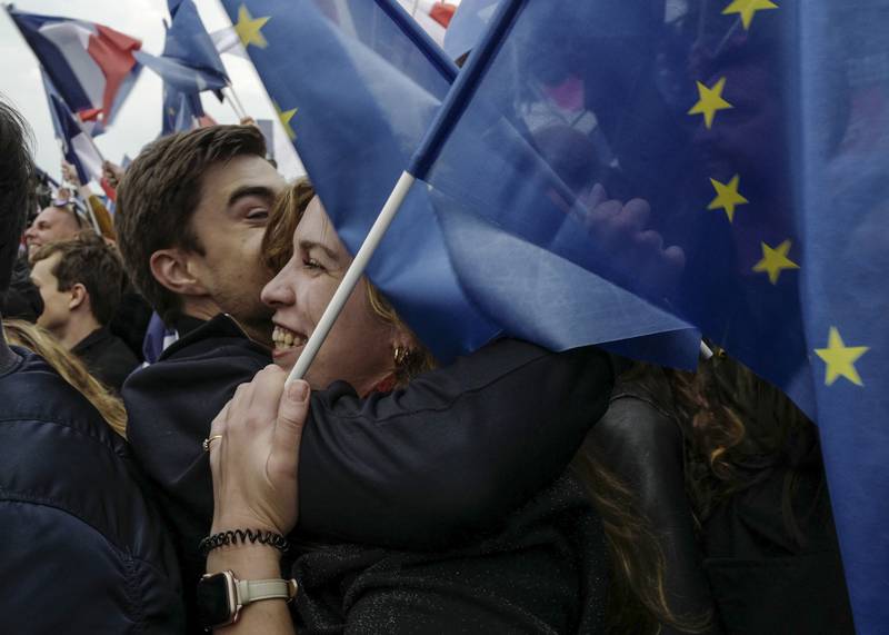 Overjoyed supporters congratulate each other after the announcement of the results. AP Photo