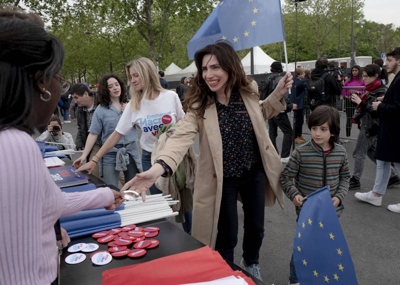 Crowds gather for Mr Macron's election night speech in the French capital. AP Photo